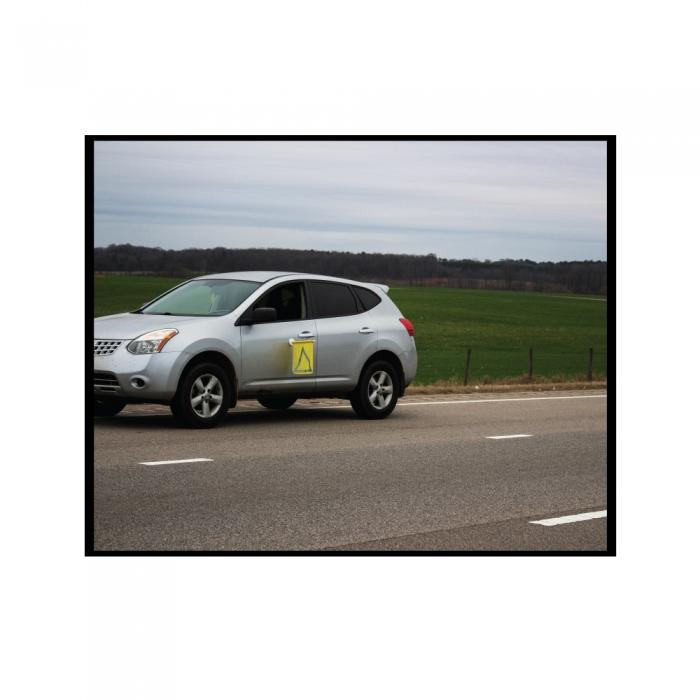 Car safety bright yellow flag tool so others will see you during a car breakdown.